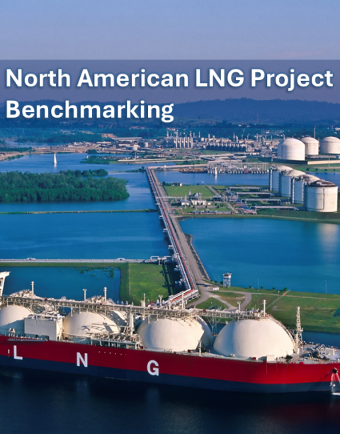 Aerial view of a liquefied natural gas (LNG) terminal with storage tanks and an LNG carrier ship docked at the facility.